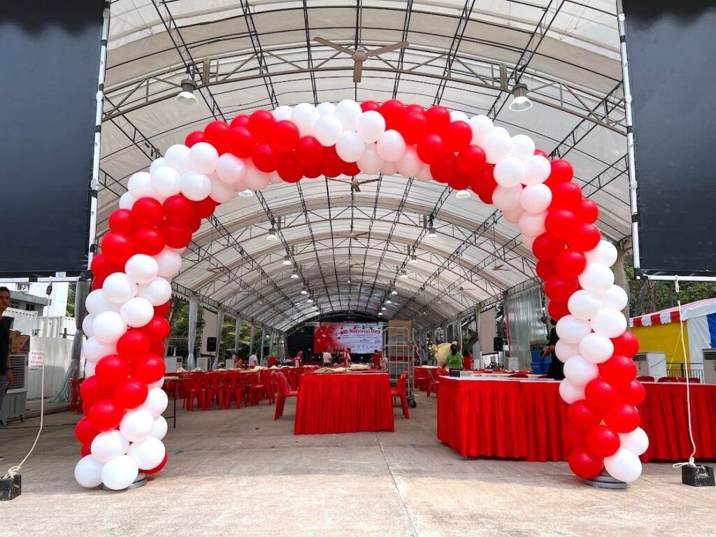 red and white balloon arch