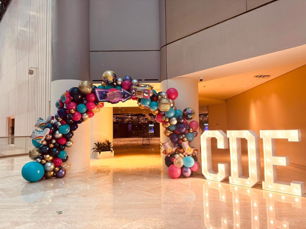 Organic balloon arch with lighted letters for rent