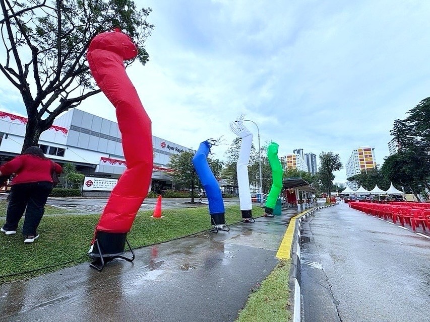 colorful air dancers inflatable tubes outdoor event singapore
