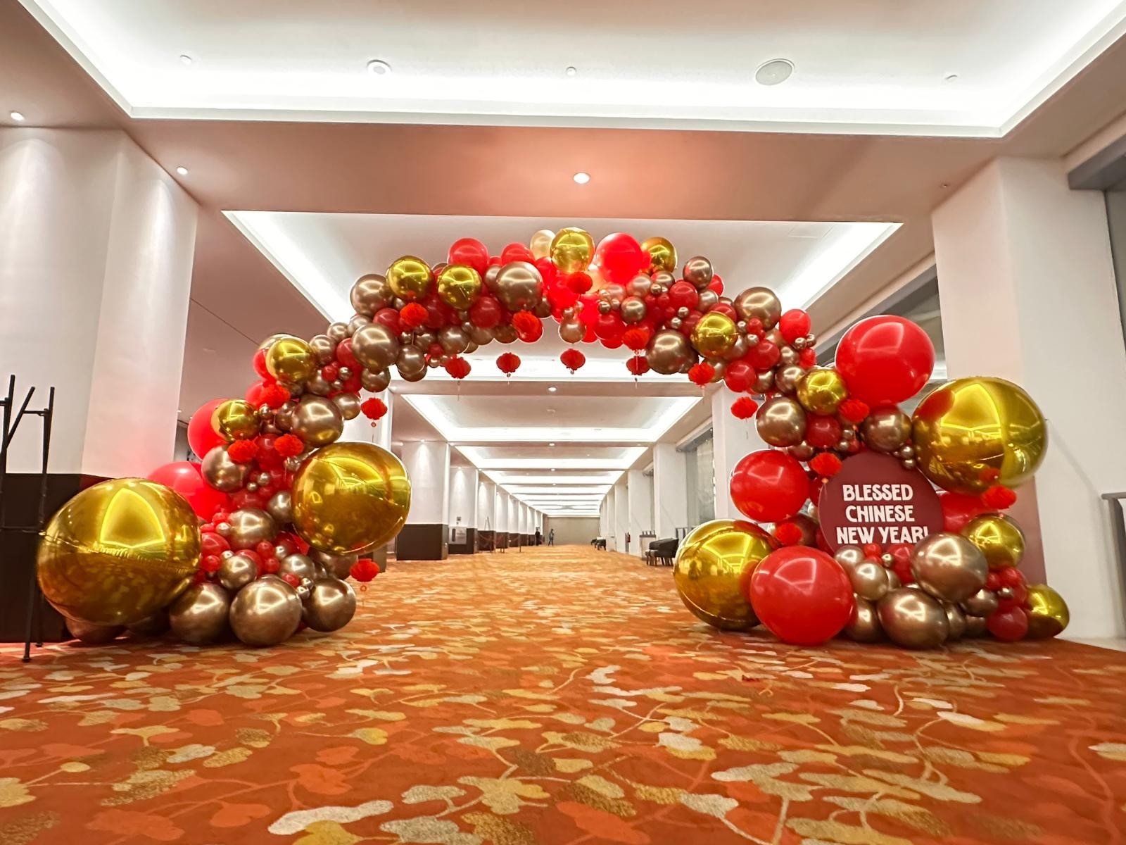 Chinese New Year Balloon Decorations Singapore with red and gold organic balloon arch