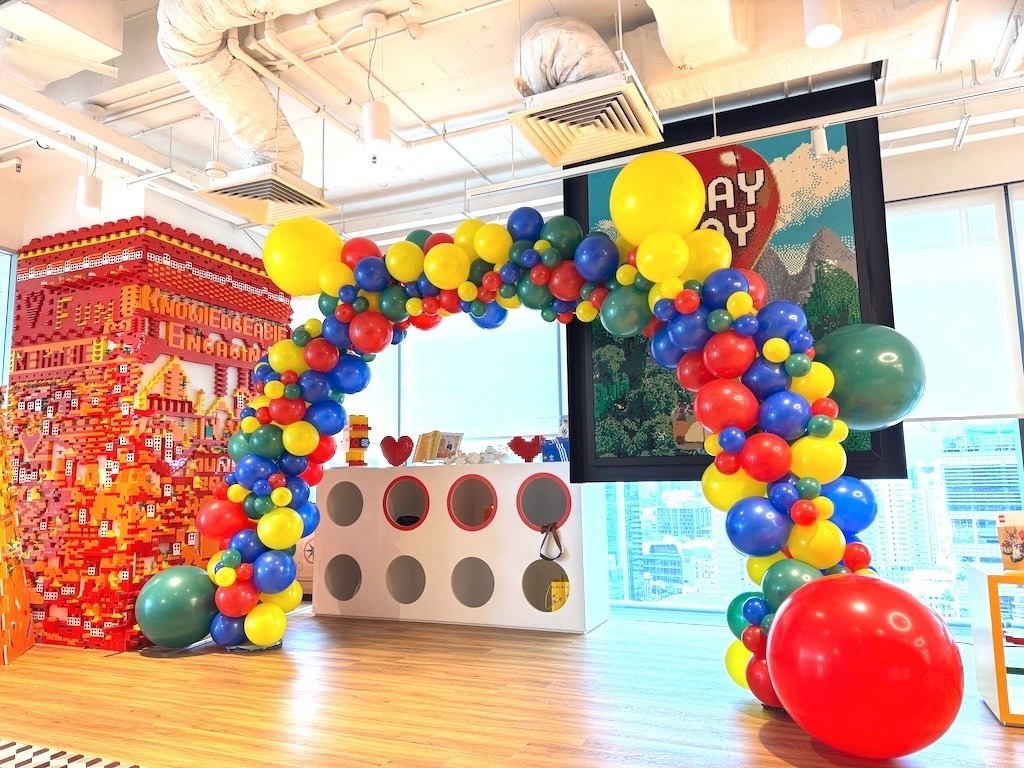 Colourful organic balloon arch with Lego theme corporate balloon decorations Singapore
