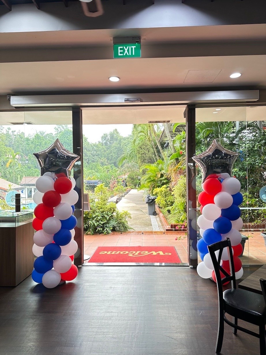 Red white blue balloon column Balloon Decorations Singapore at event entrance