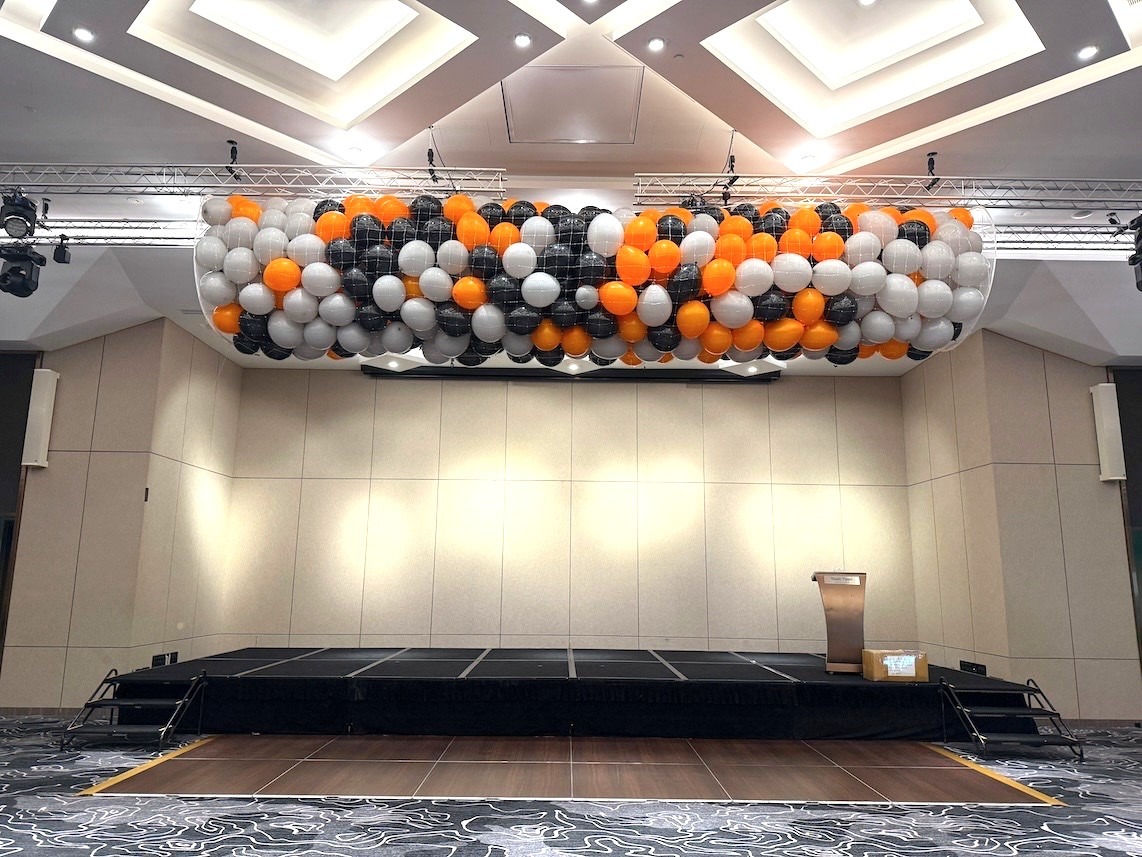 Balloon drop net installation for corporate event stage in Singapore