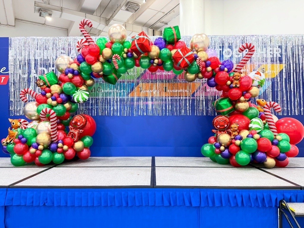 Balloon Decorations Singapore: Hidden Costs Breakdown & Price Transparency Guide 9 Christmas organic balloon arch on corporate event stage Singapore