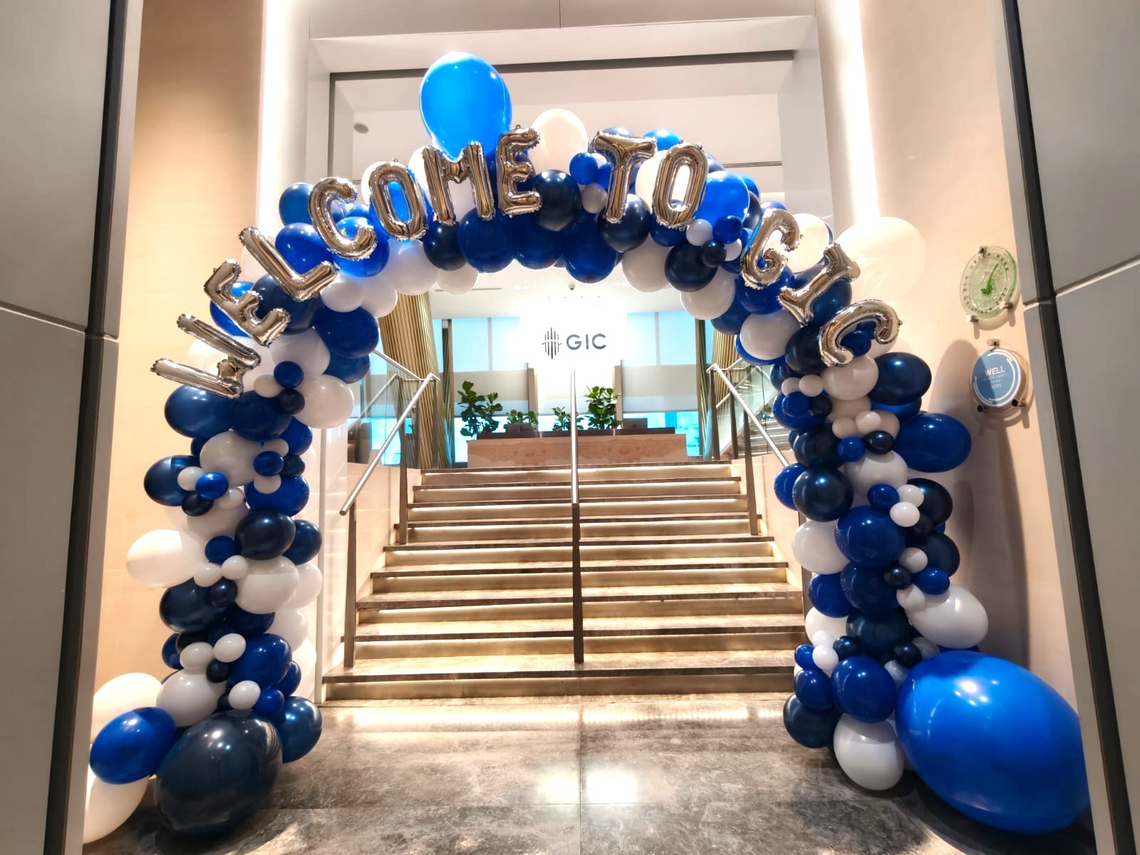 Balloon Decorations Singapore: Hidden Costs Breakdown & Price Transparency Guide 4 Corporate welcome organic balloon arch in blue and white for Singapore event