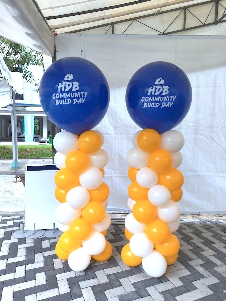 Custom-printed balloon columns advertising balloons for corporate community event Singapore