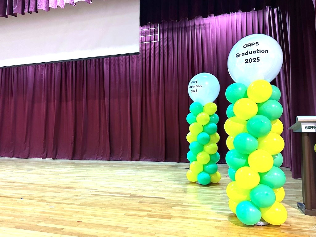 Balloon Decorations Singapore: Hidden Costs Breakdown & Price Transparency Guide 8 Graduation balloon columns decorating a school hall in Singapore