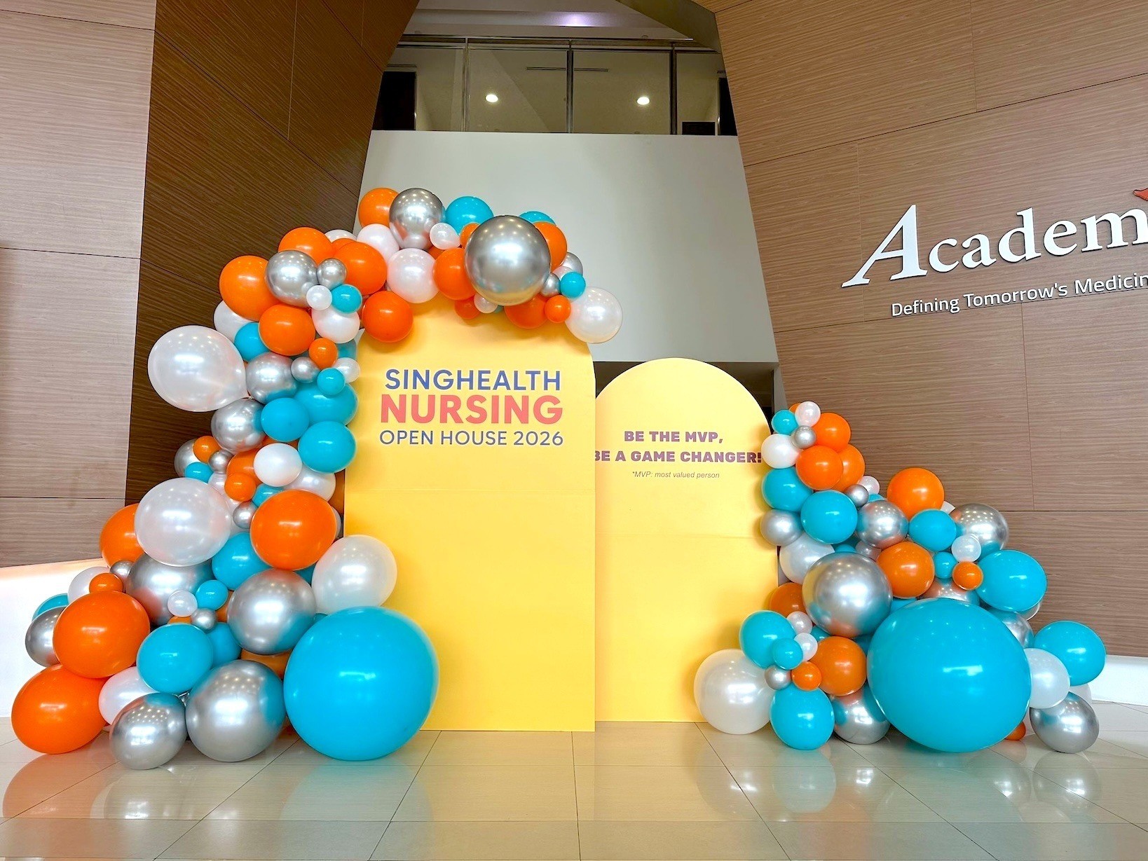 Organic balloon arch backdrop for corporate open house balloon decorations Singapore