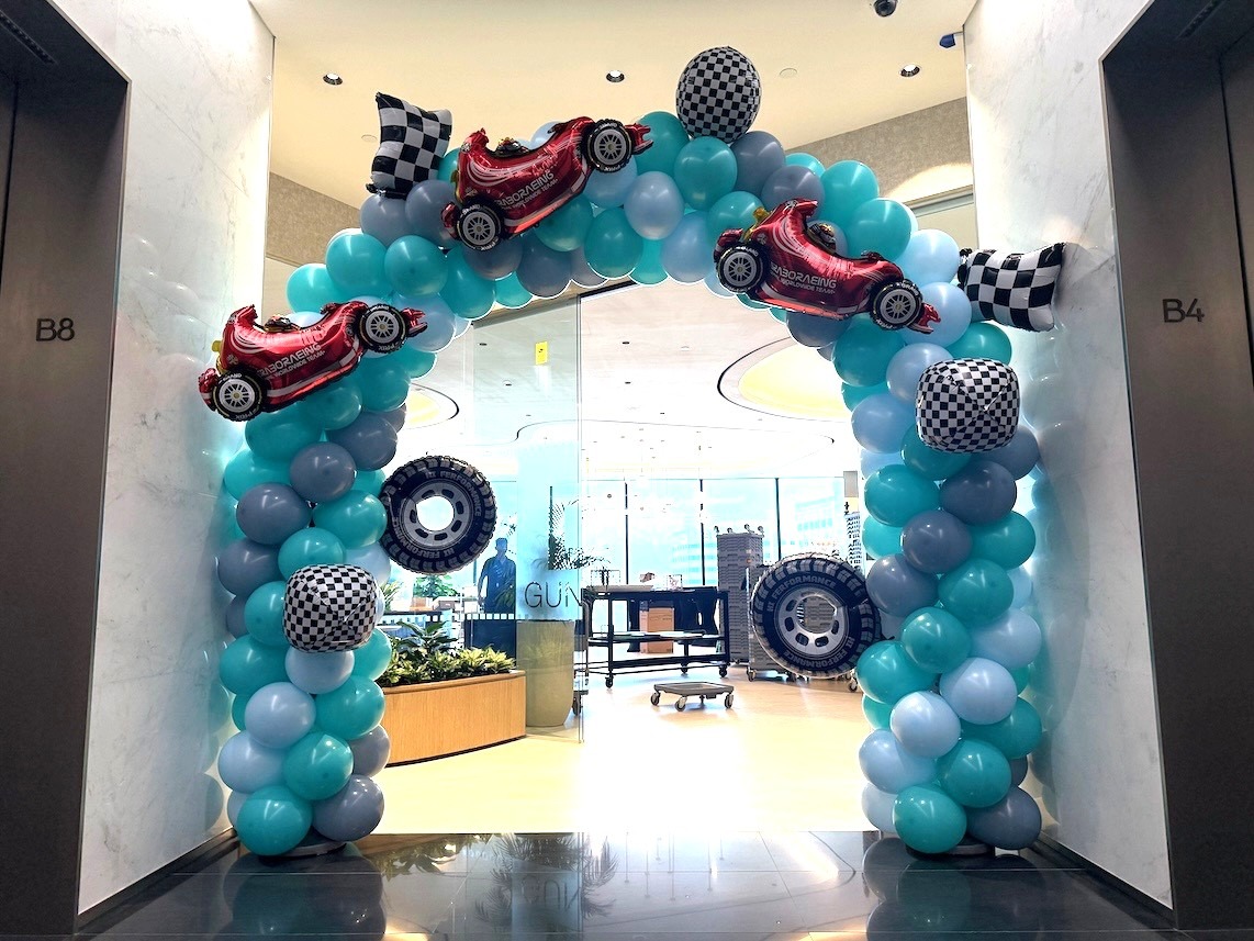 Racing-themed balloon arch for corporate event decoration in Singapore
