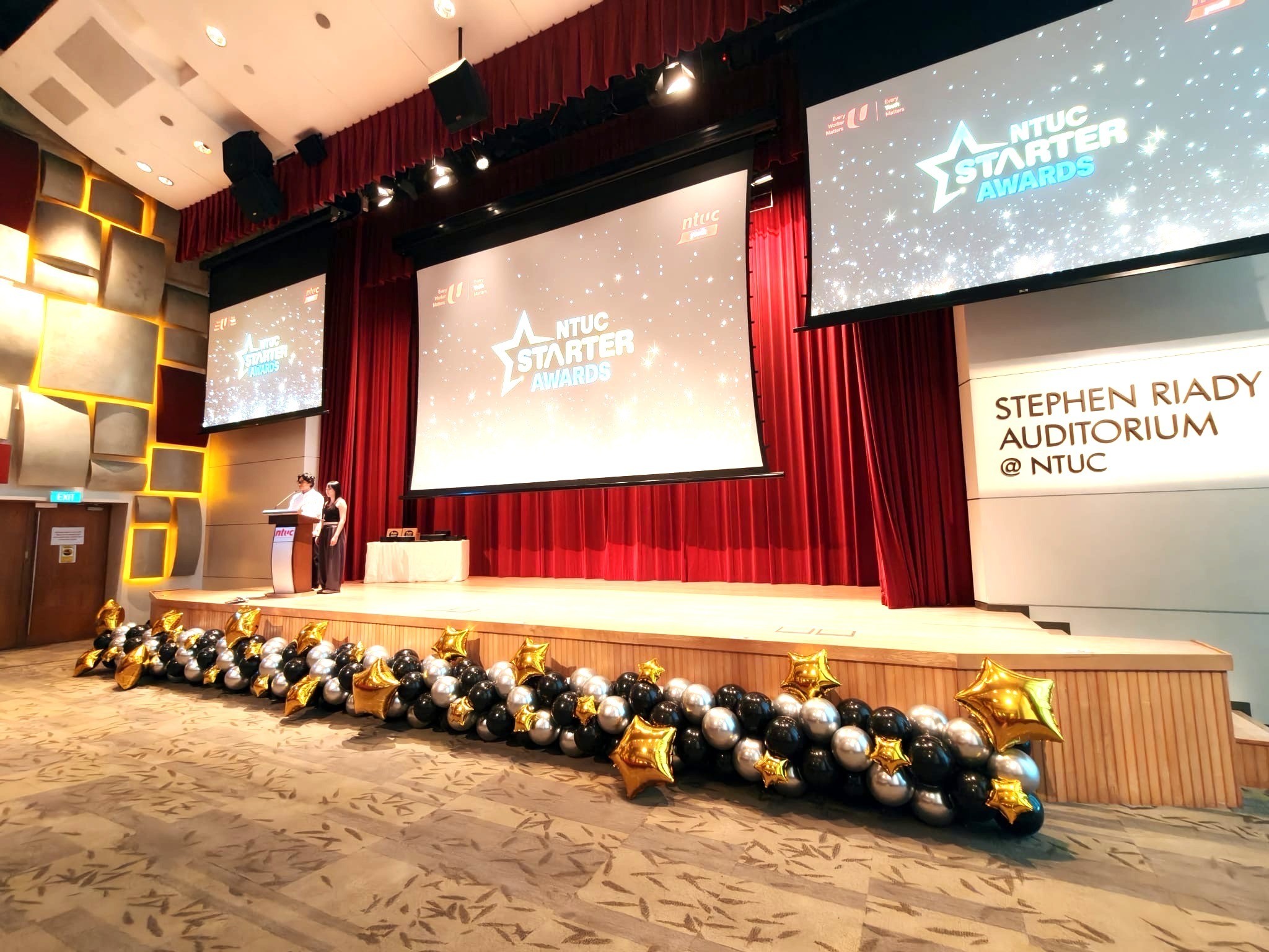 Black gold and silver balloon garland stage decoration for corporate awards ceremony Singapore
