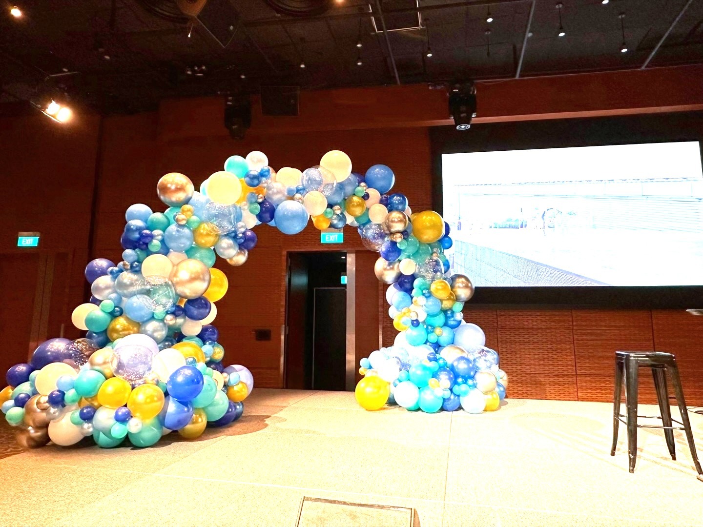 Organic blue and gold balloon arch corporate event stage balloon decorations Singapore