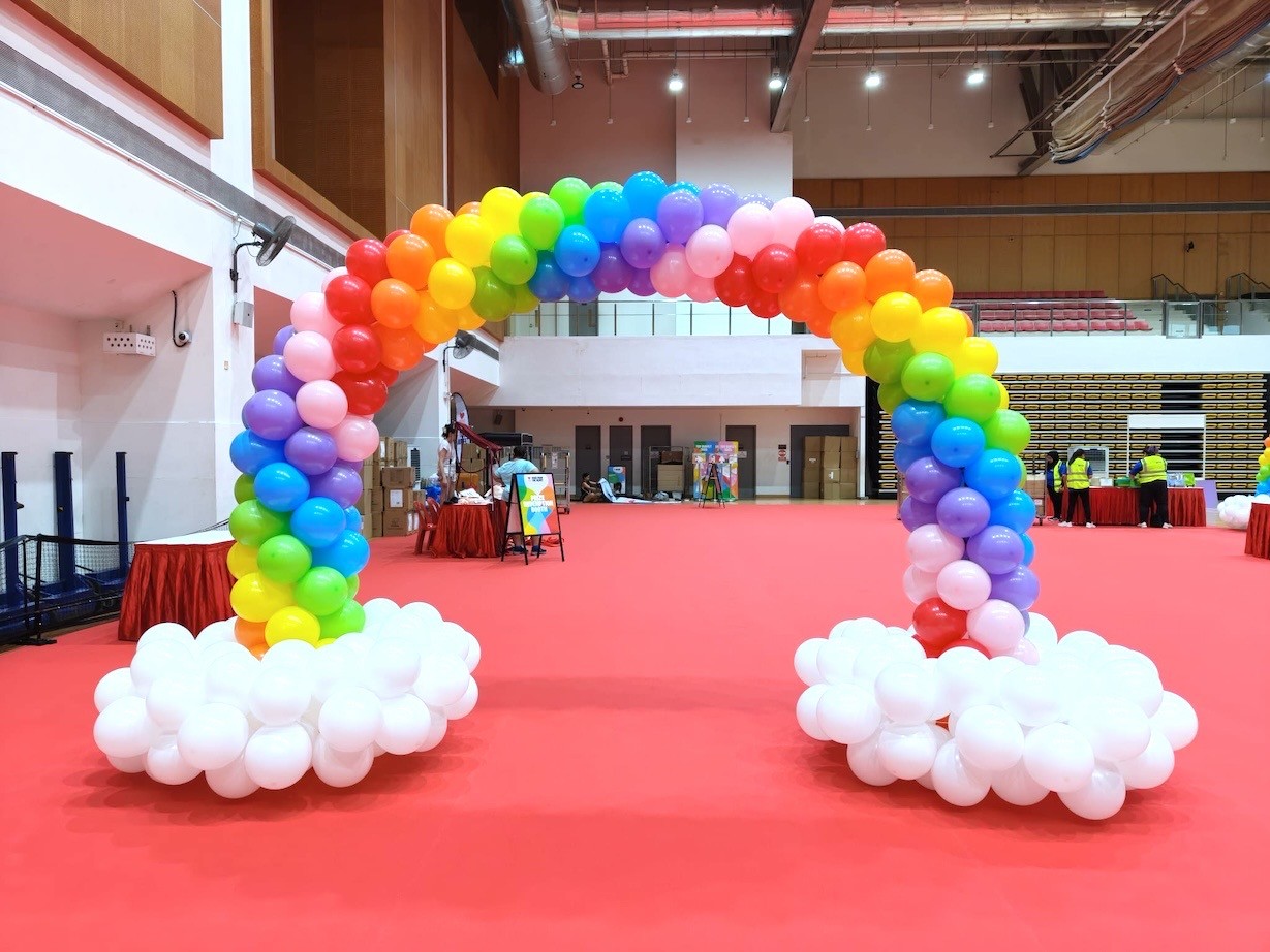 Rainbow balloon arch with white cloud base event balloon decorations Singapore