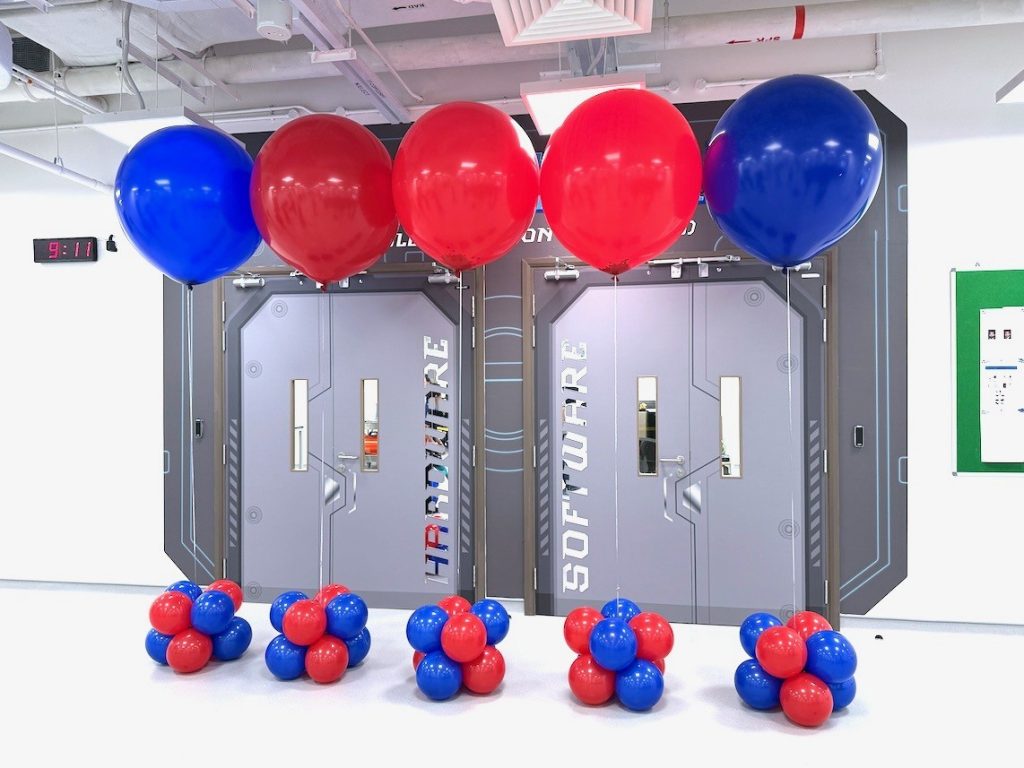 Giant red and blue helium balloon columns at a corporate event in Singapore