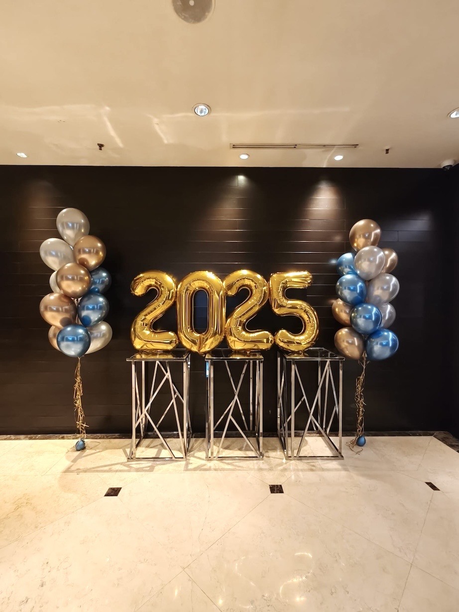 Gold foil number 2026 helium balloon display at corporate event Singapore