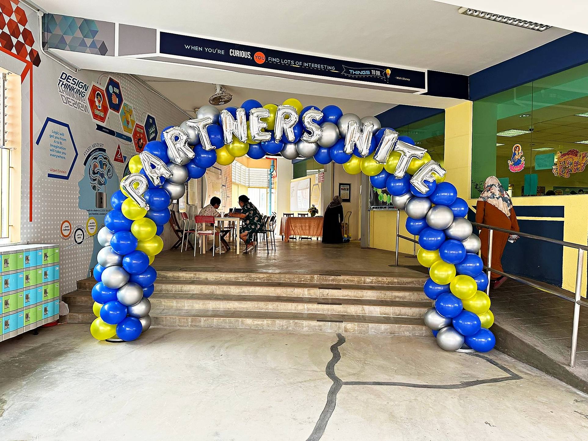 Blue silver and yellow balloon arch with event lettering