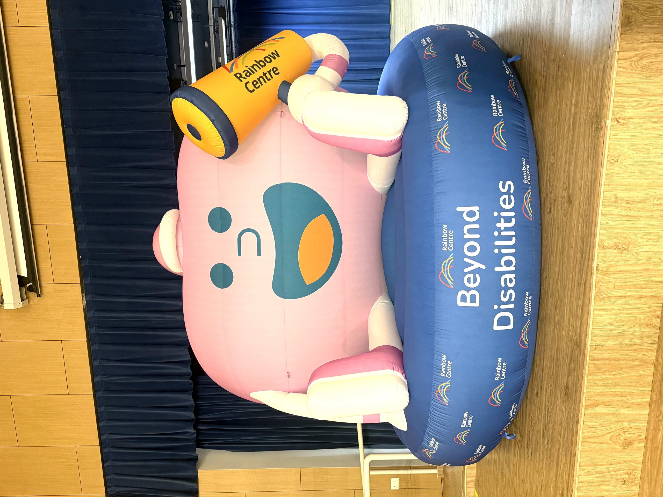 Custom inflatable mascot at Rainbow Centre corporate event in Singapore