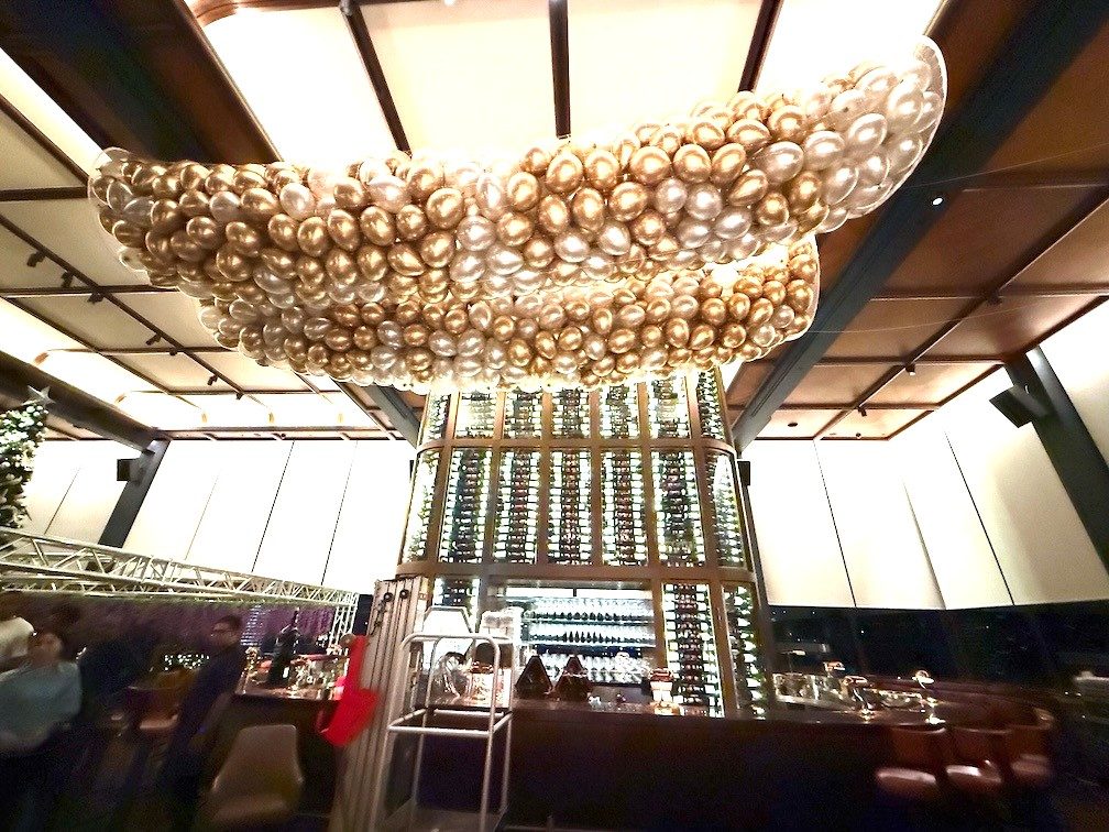 Gold chrome balloon ceiling installation luxury event Singapore