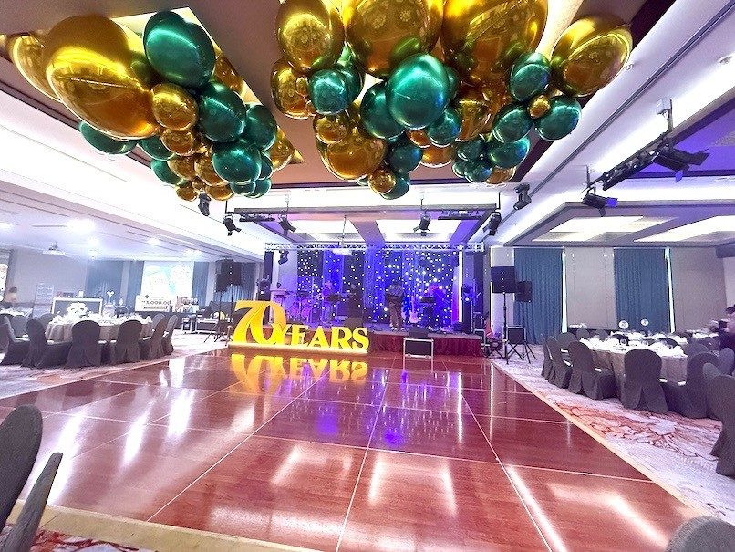 Gold green ceiling balloon cluster corporate gala dinner Singapore