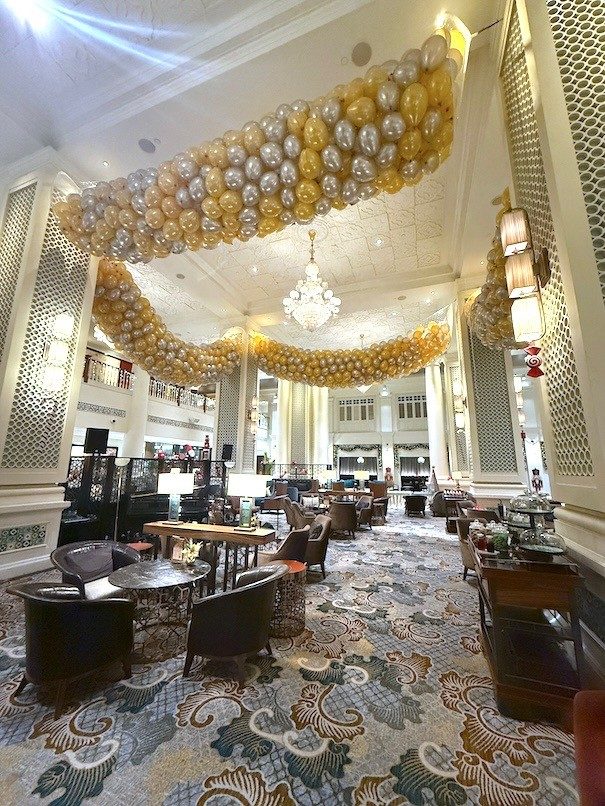 Grand hotel lobby gold silver balloon ceiling installation Singapore