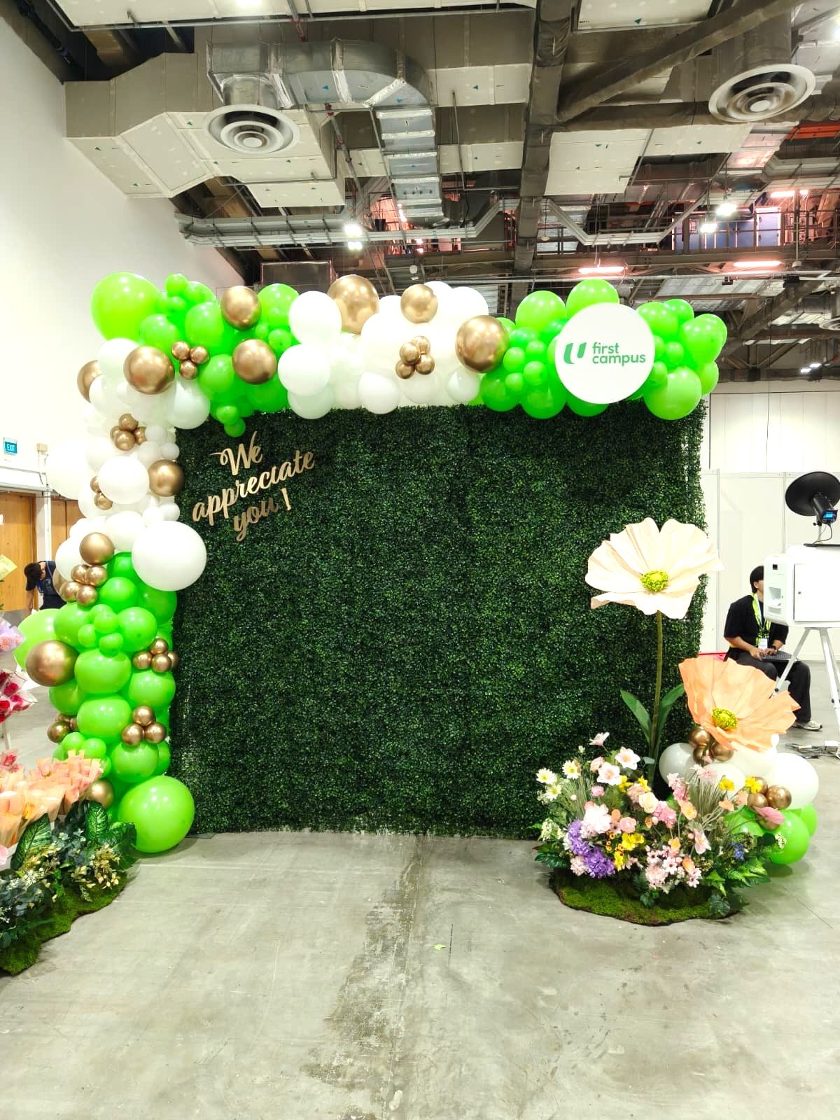 Green gold white balloon arch greenery backdrop corporate event Singapore