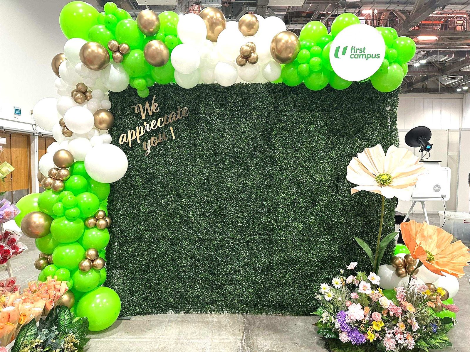 Green gold white balloon garland greenery backdrop corporate event Singapore