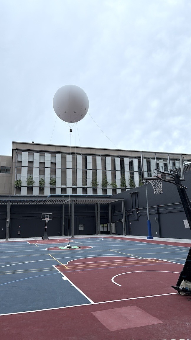 The Most Popular Advertising Balloon Singapore Looks Trending at Events in 2026 10 Large white advertising balloon at outdoor school event in Singapore