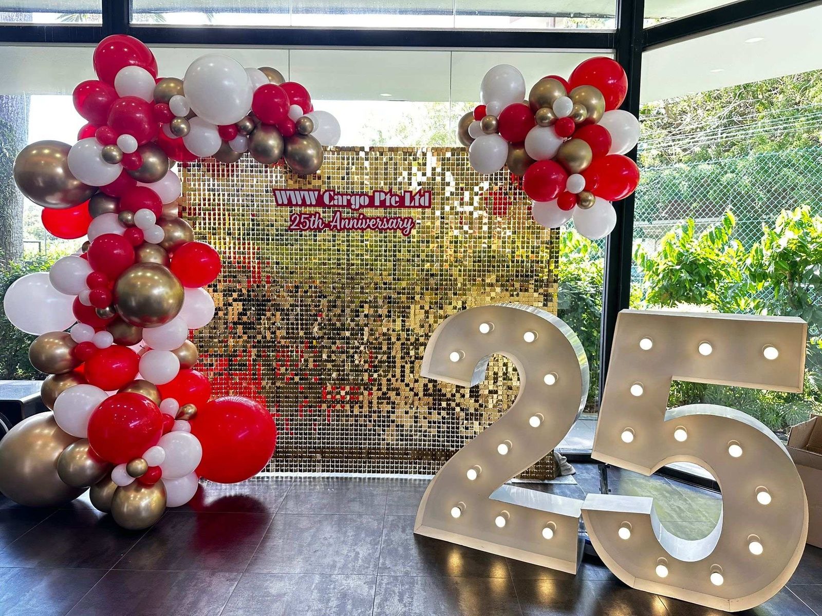 Organic balloon arch sequin backdrop corporate anniversary Singapore