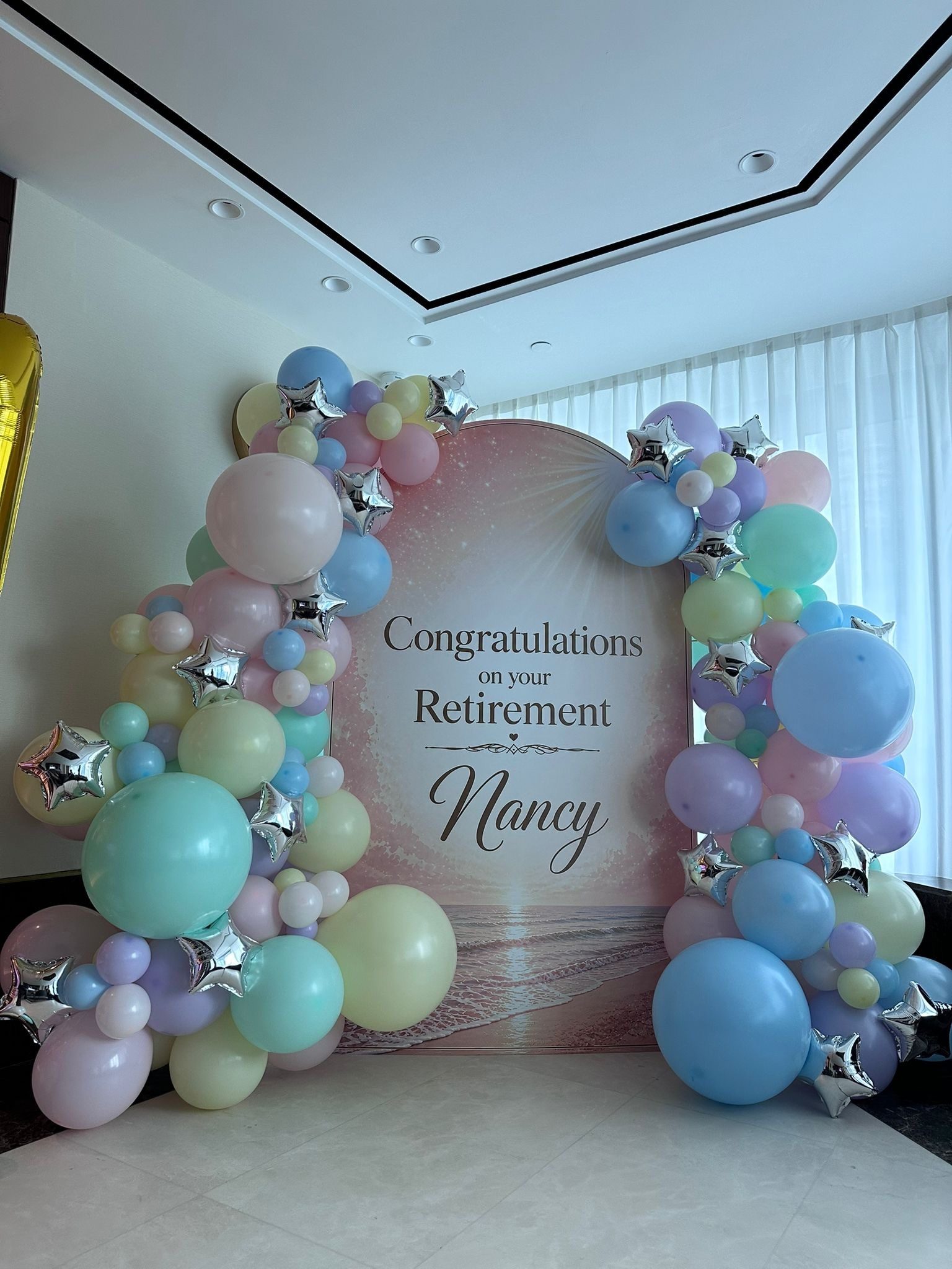 Pastel balloon garland arch retirement party backdrop Singapore