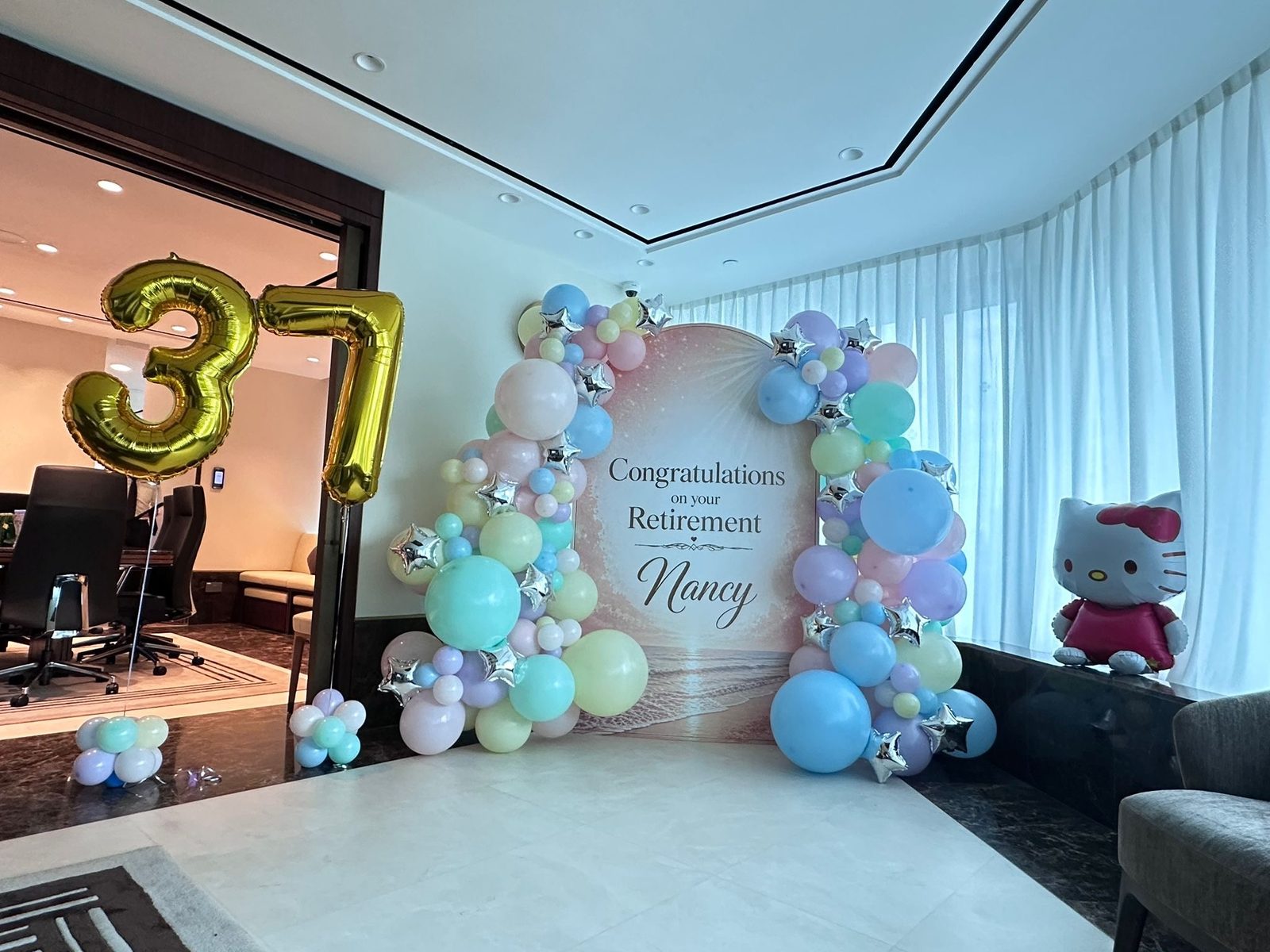 Pastel balloon garland retirement party backdrop decoration Singapore