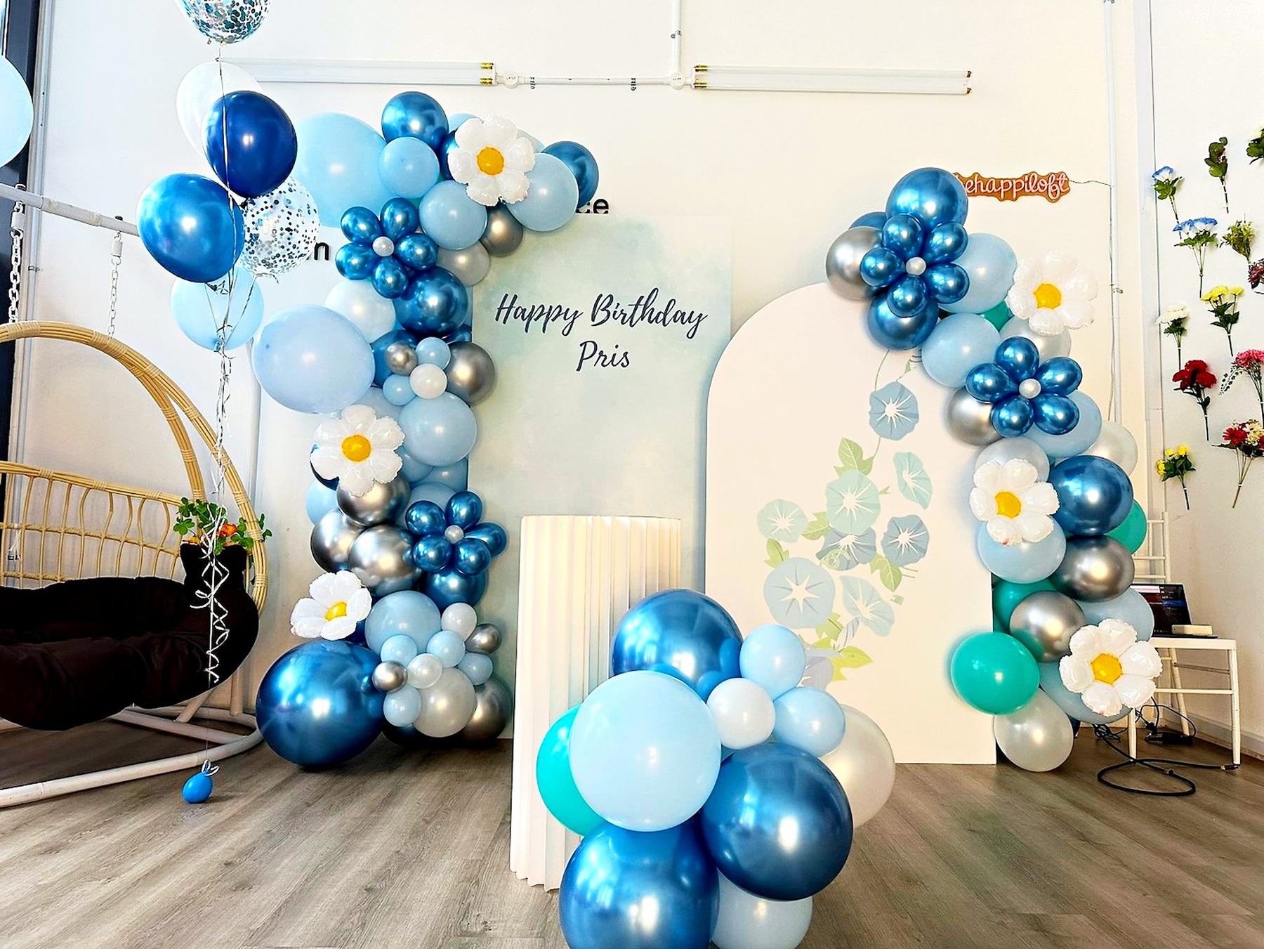 Blue daisy birthday backdrop with curved panels