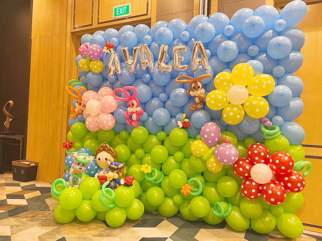 Garden themed balloon wall with colourful flowers